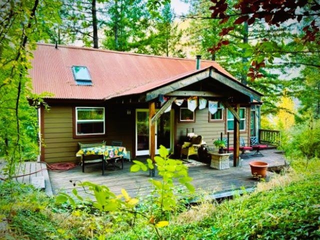 a front view of a house with a garden and porch