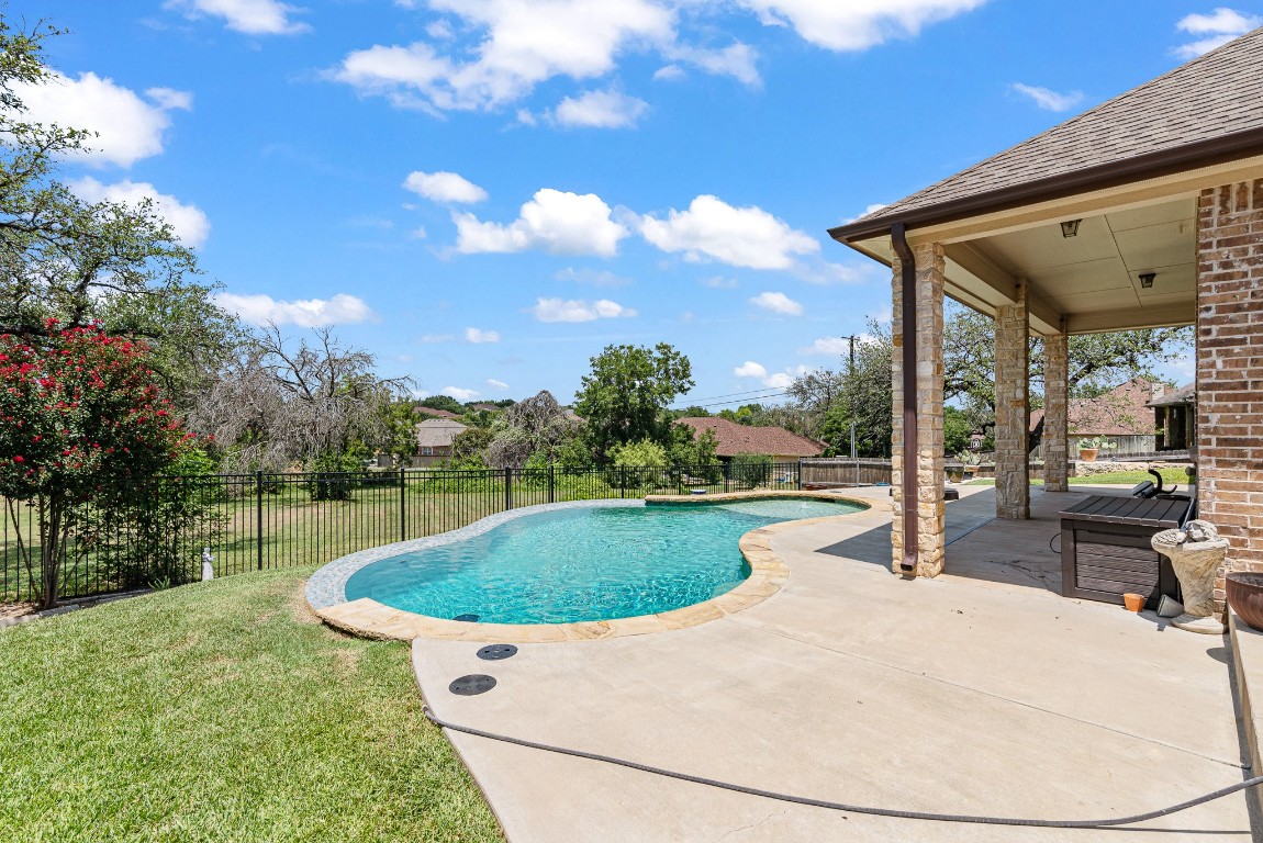 a view of a swimming pool with a patio