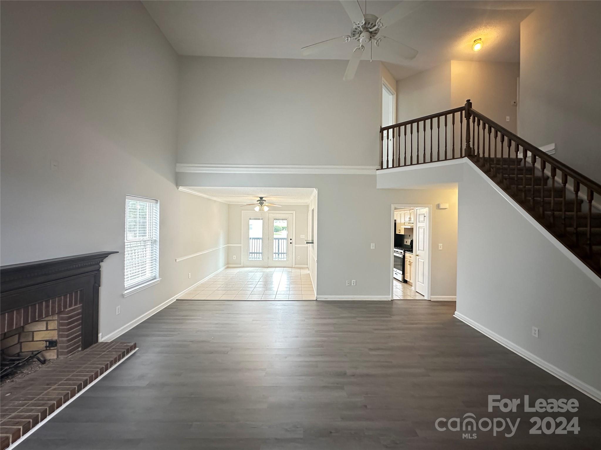 a view of an entryway with wooden floor