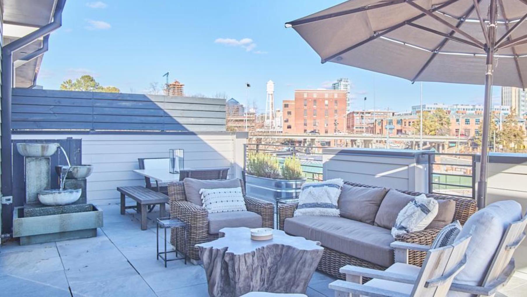 a view of a terrace with furniture and a patio