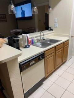 a kitchen with a sink and a stove