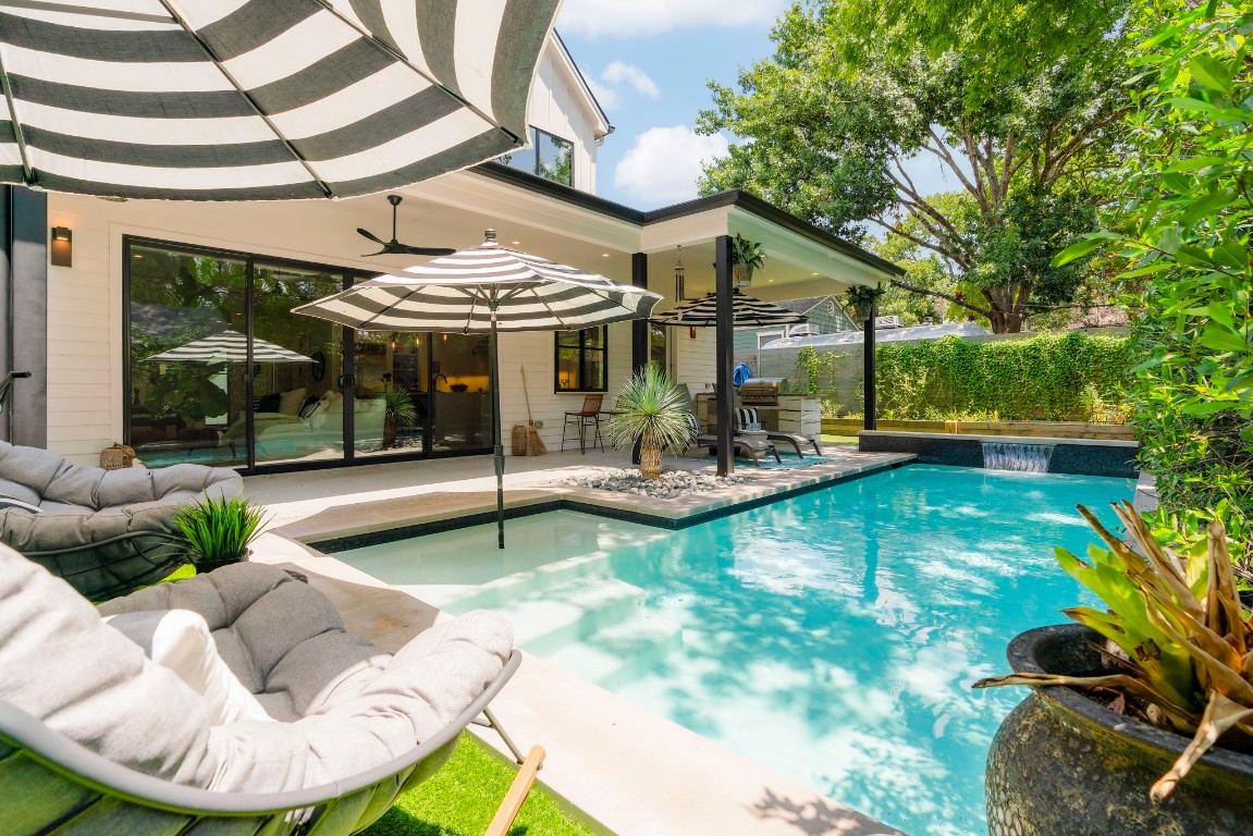 a view of a patio with a table and chairs