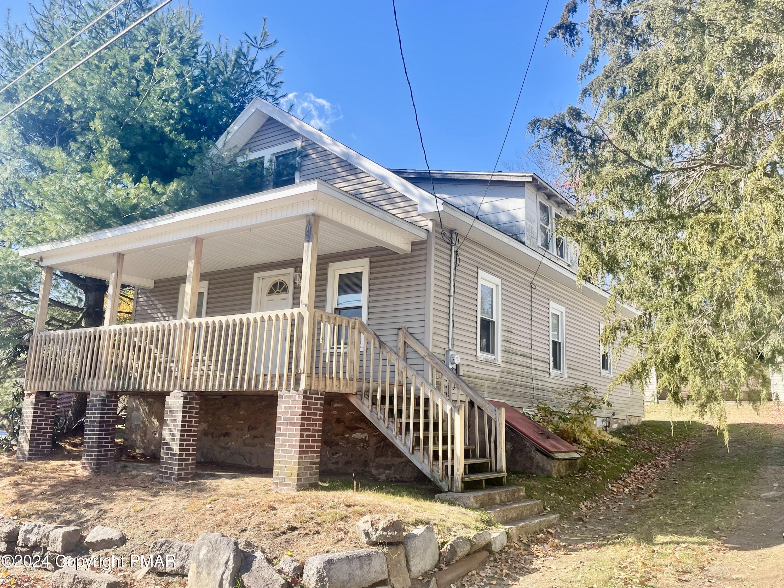 a front view of a house with a porch