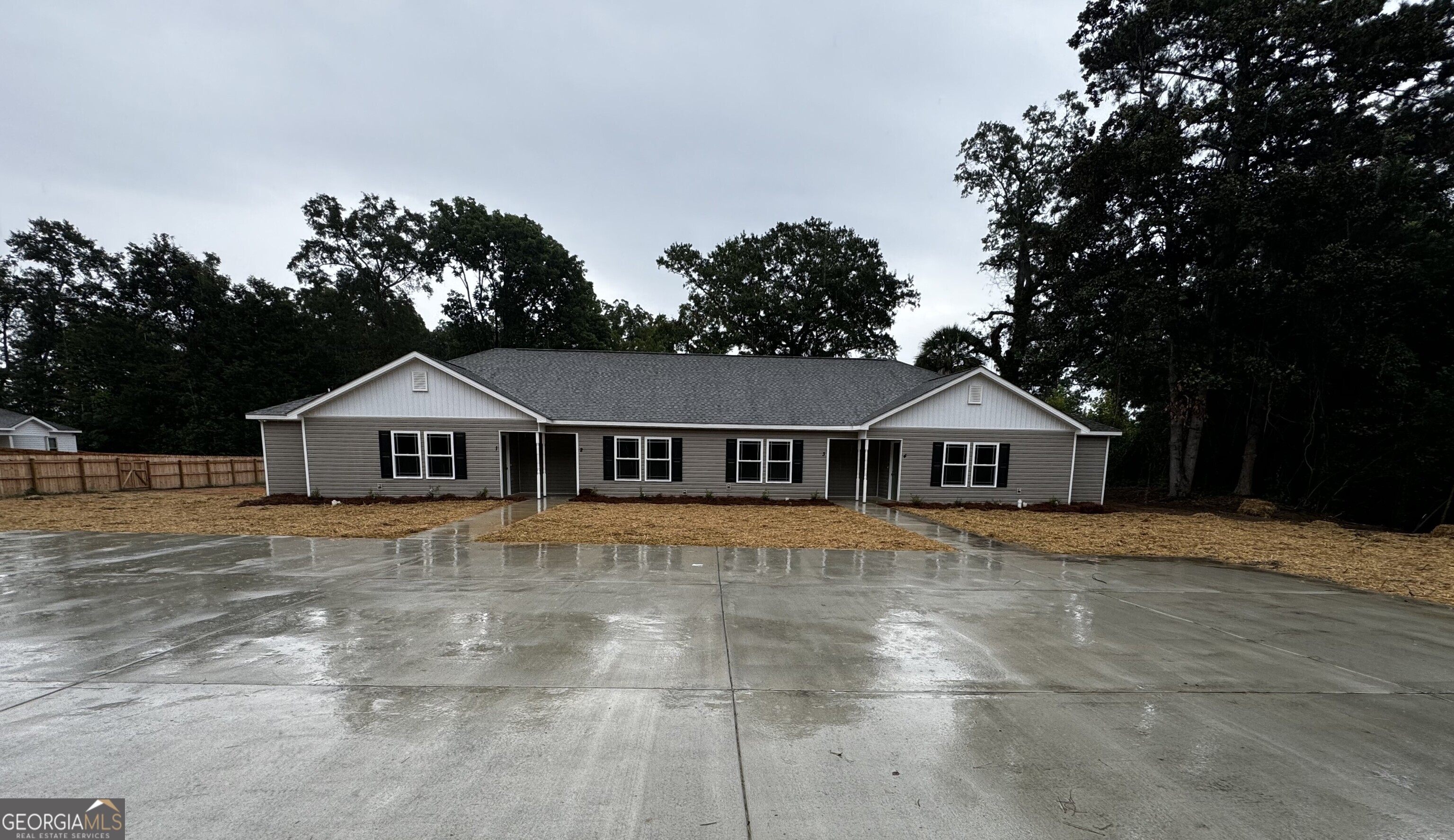 a front door view of a house with a yard