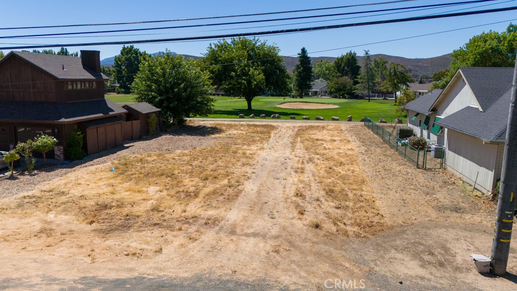 a view of a backyard of the house