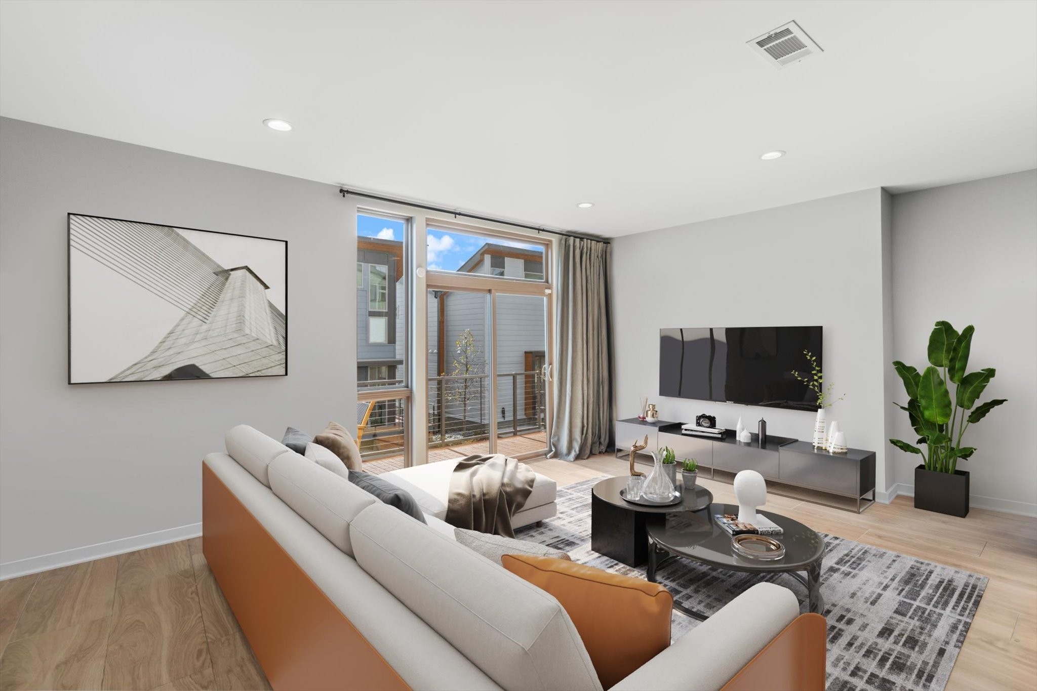 a living room with furniture and a flat screen tv