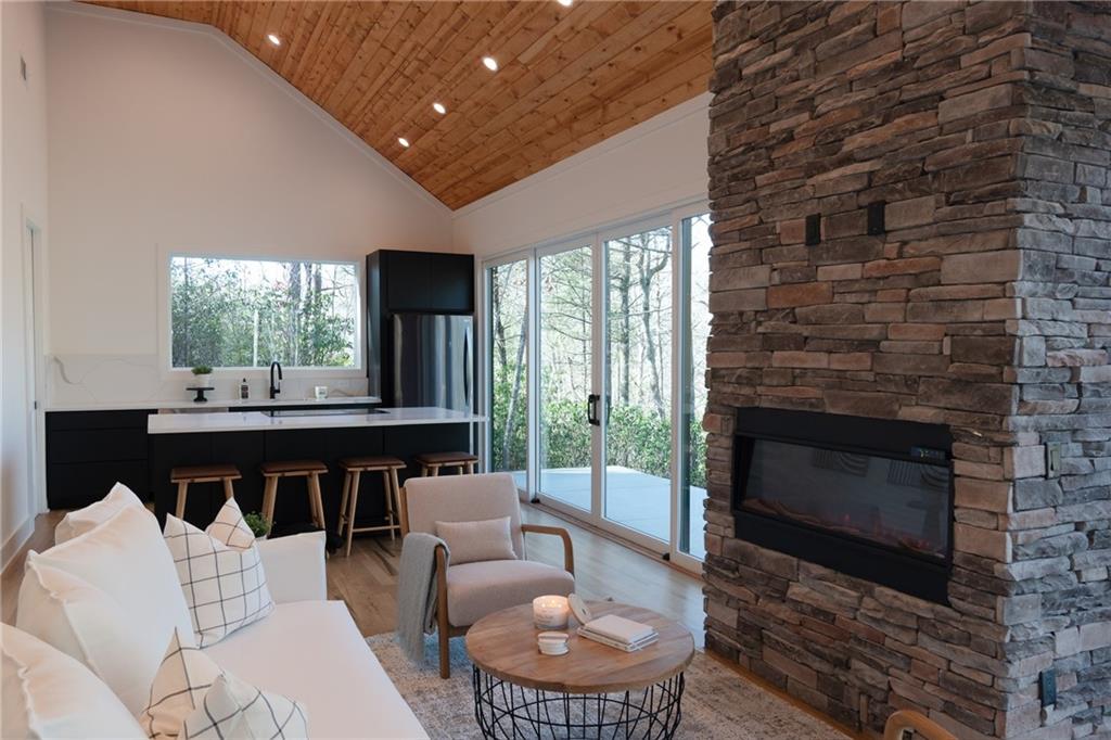 a living room with furniture a window and a fireplace