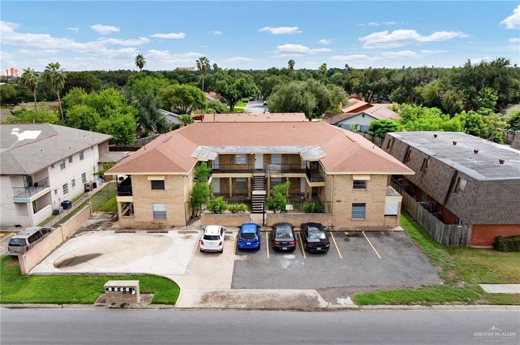 an aerial view of a house with garden space and street view