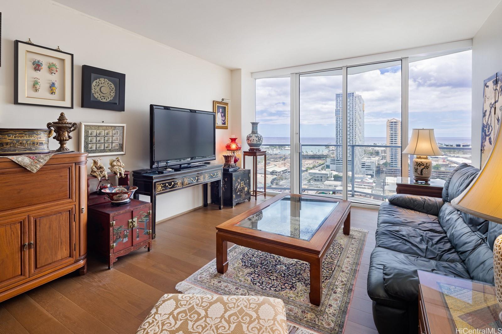 a living room with furniture and a flat screen tv