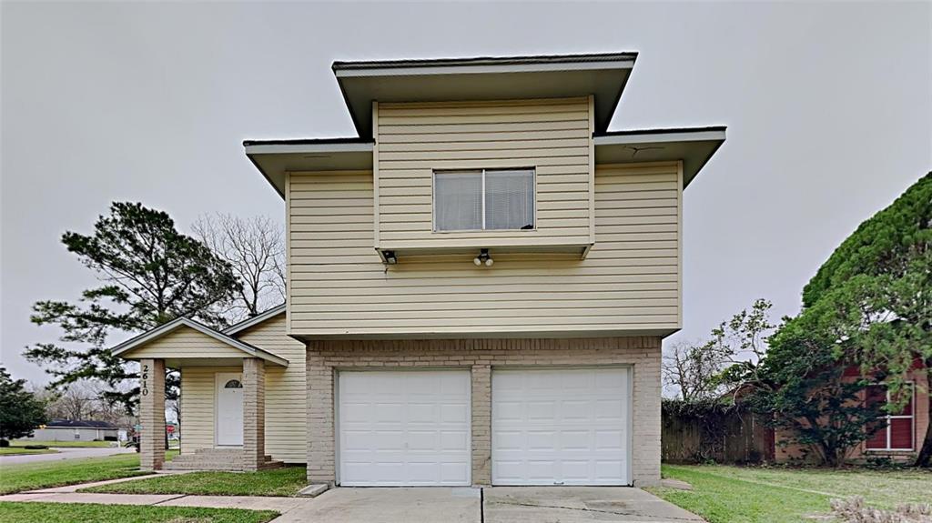 a house that has a tree in front of it