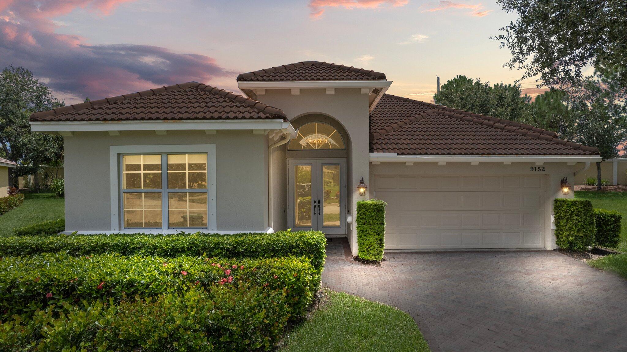 a front view of a house with a yard