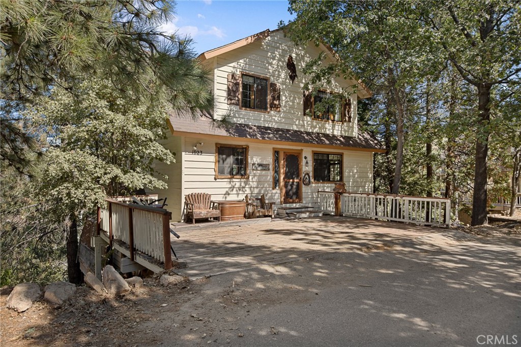 a view of a house with backyard porch and sitting area