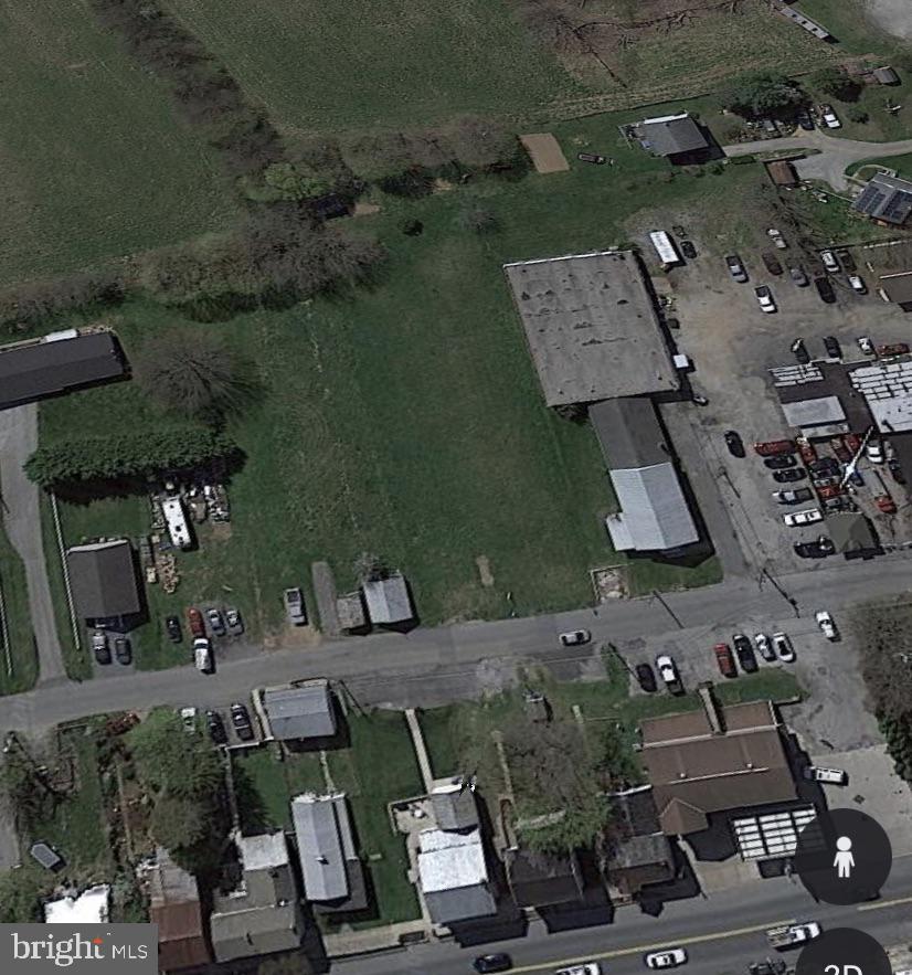 an aerial view of multiple houses with outdoor space