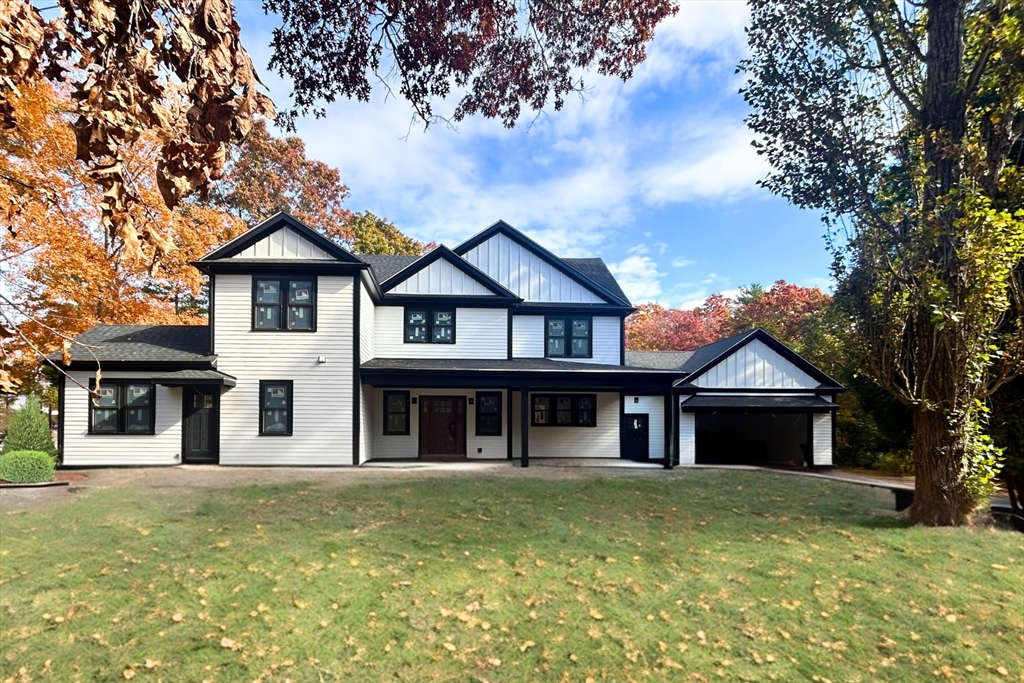 front view of a house with a yard