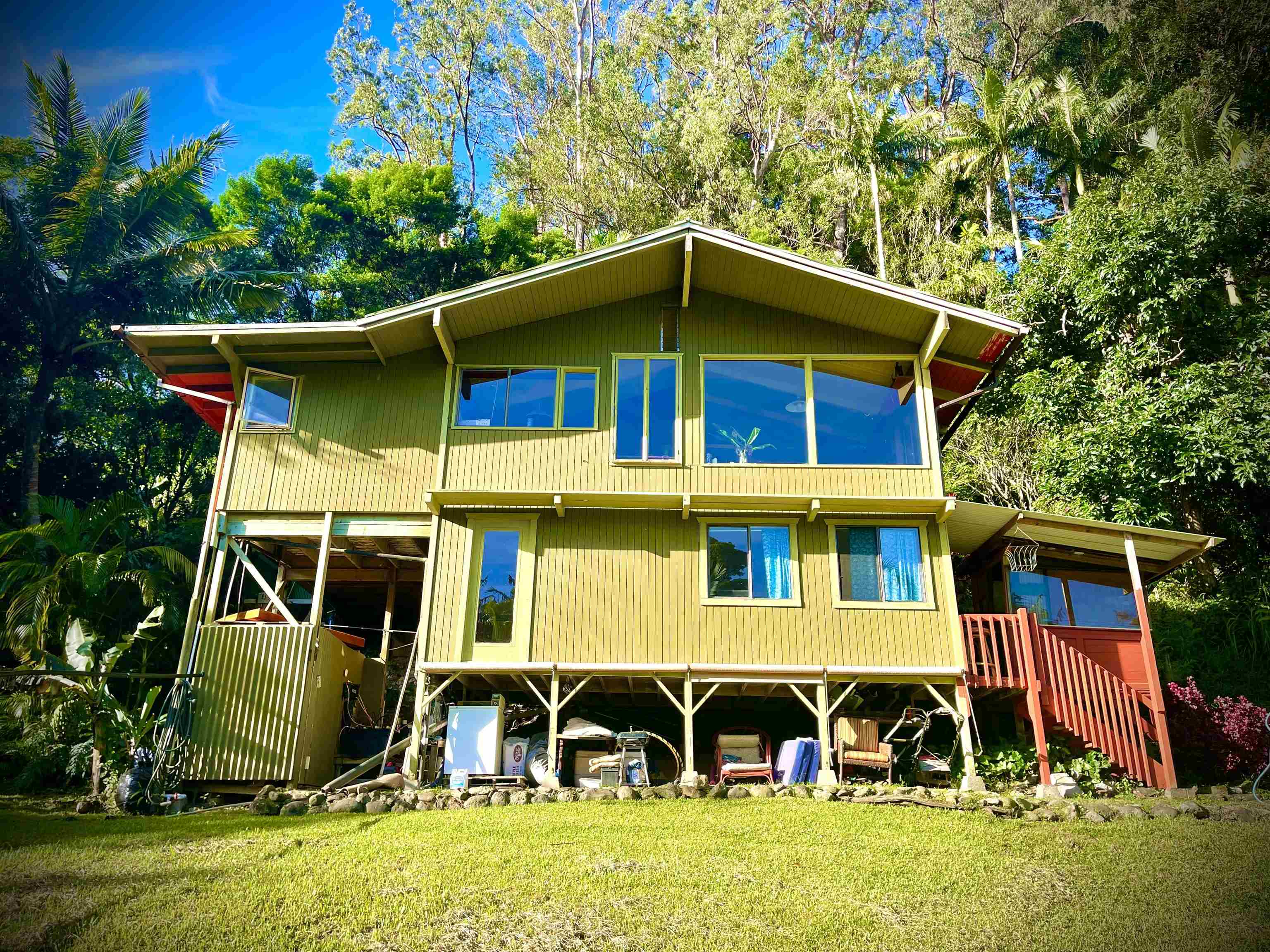 a front view of a house with garden