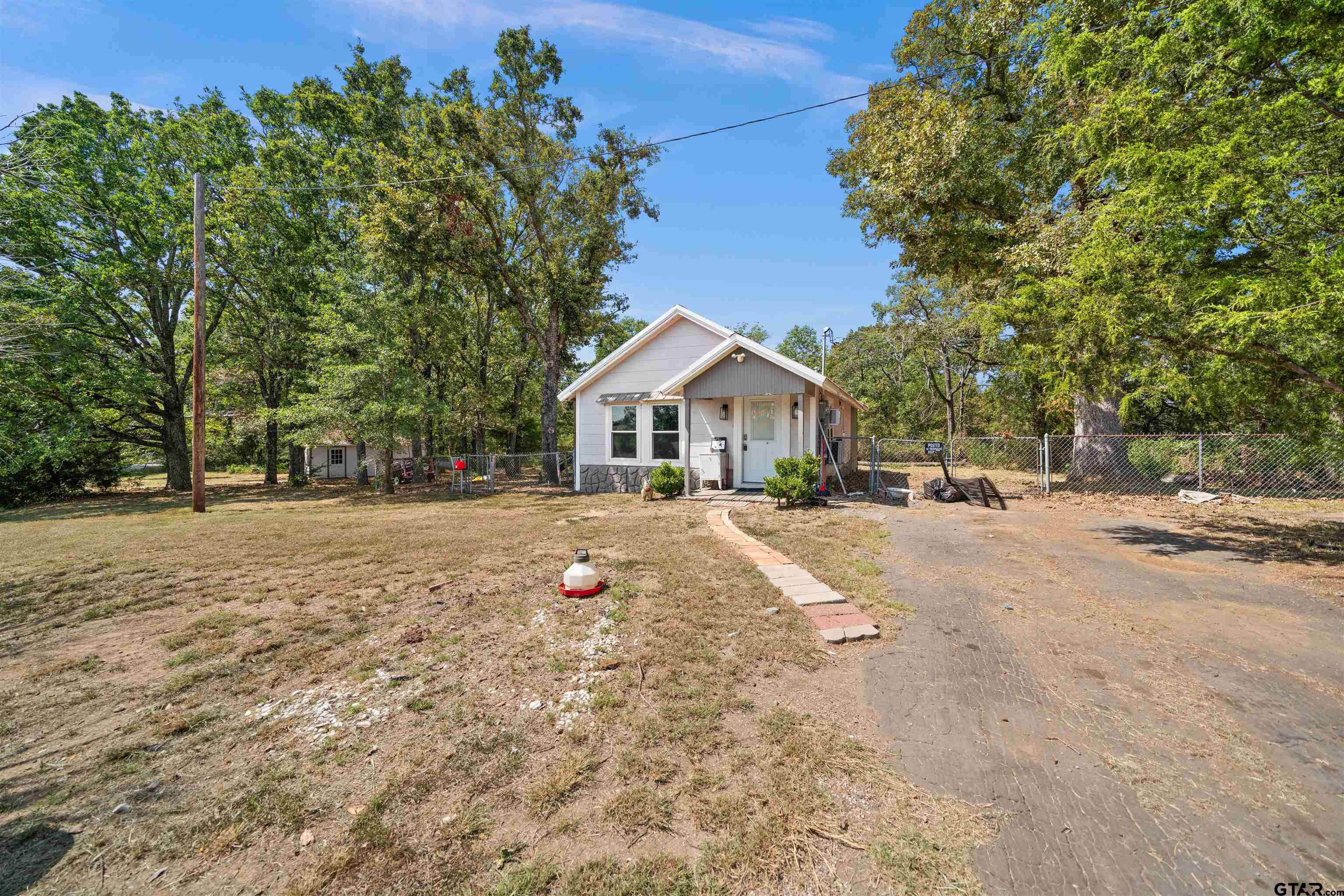 a view of house with yard