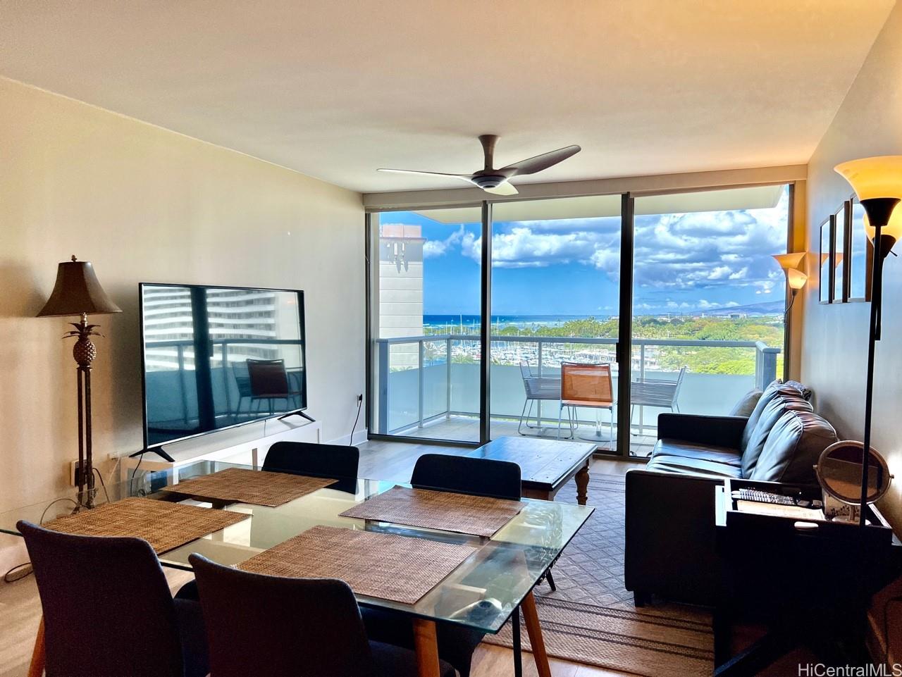 a view of a dining room with furniture window and outside view