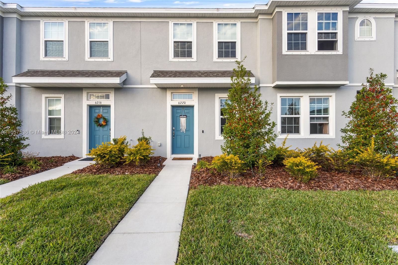 front view of a house with a yard