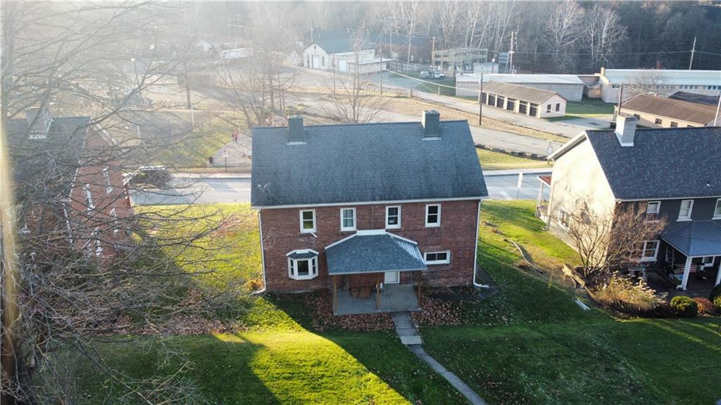 a aerial view of a house with swimming pool