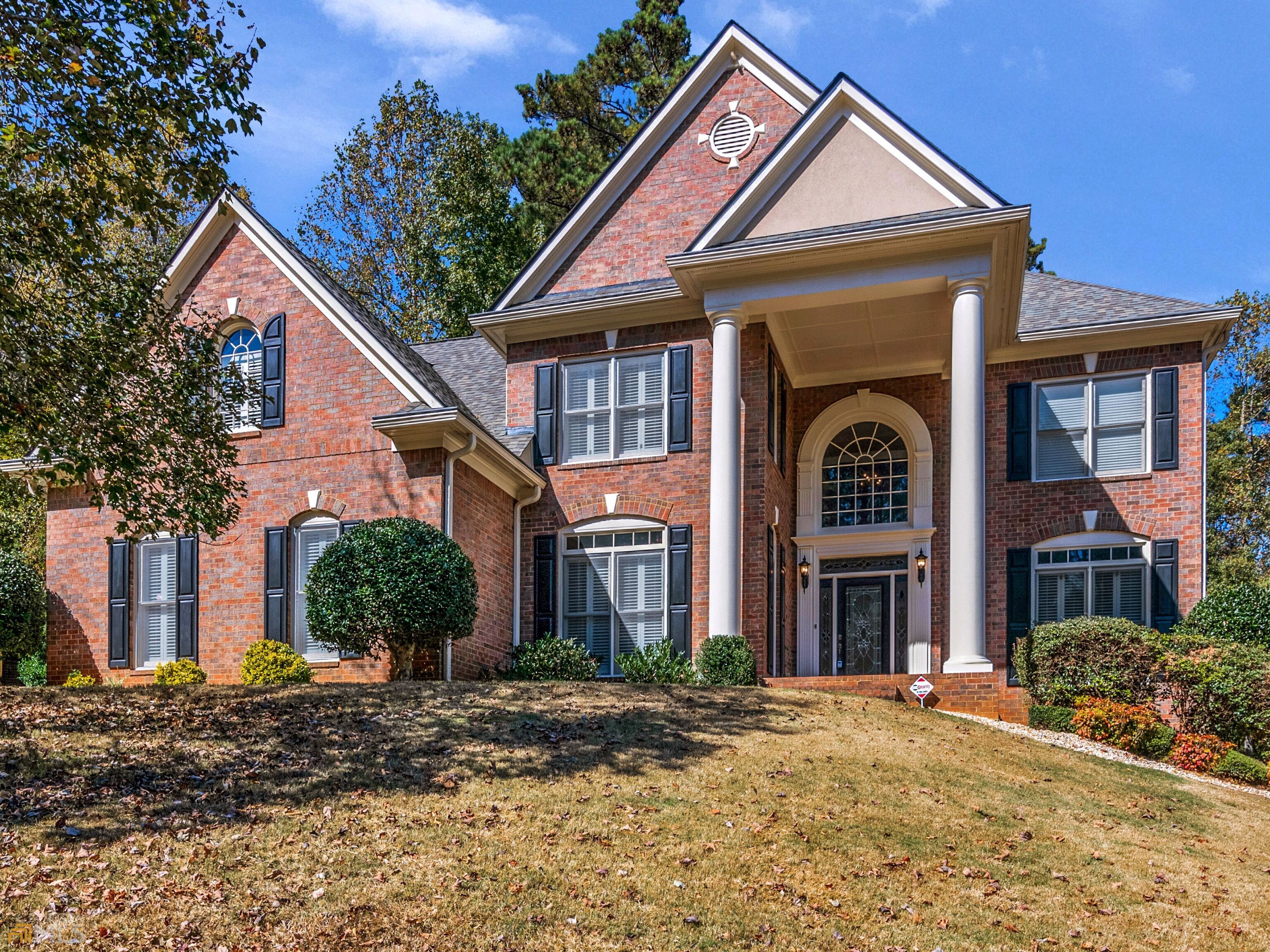 a front view of a house with a yard