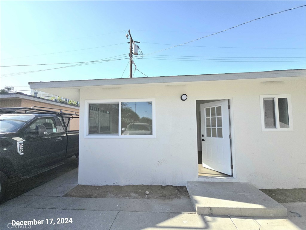 a front view of a house with parking space