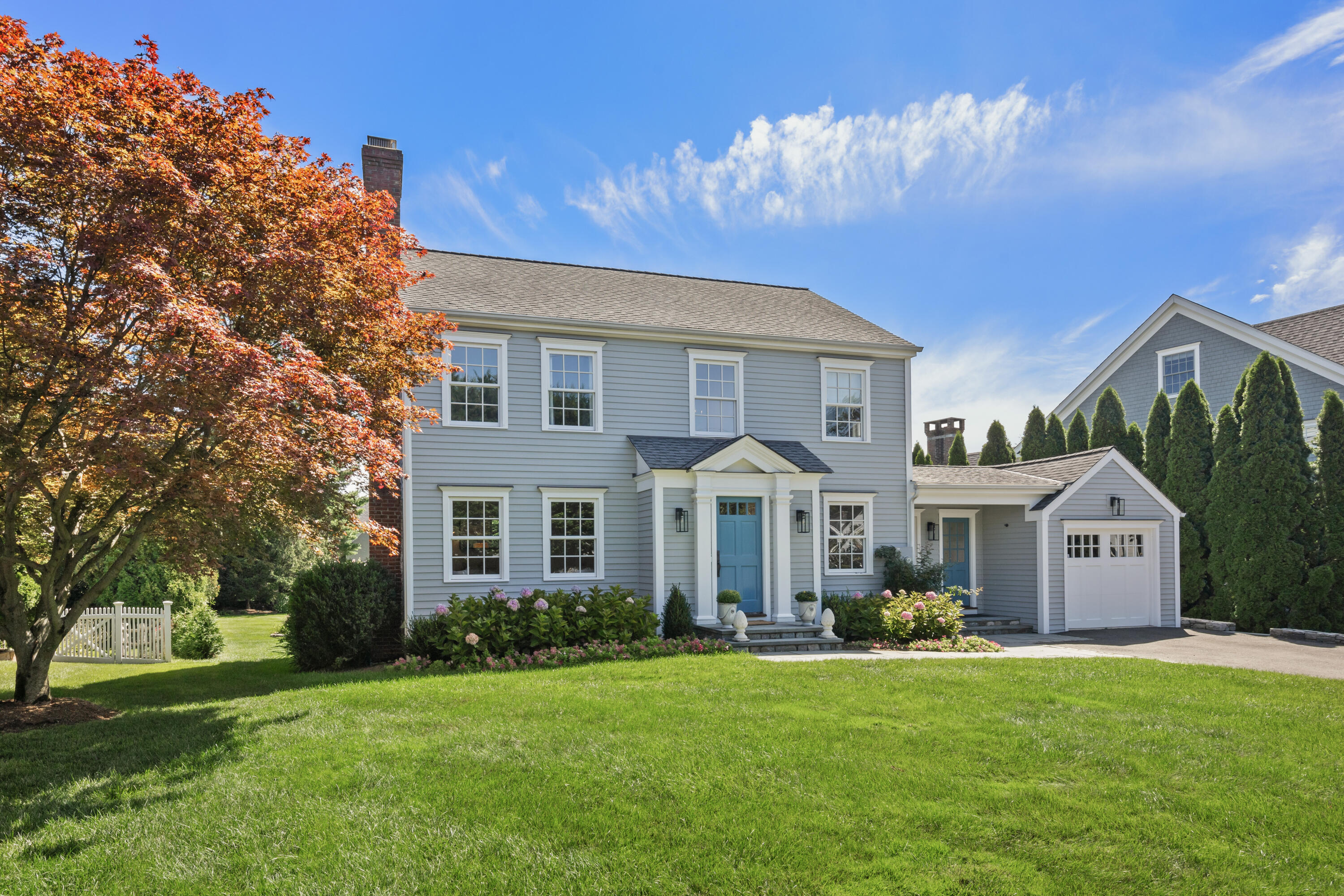 a front view of a house with garden