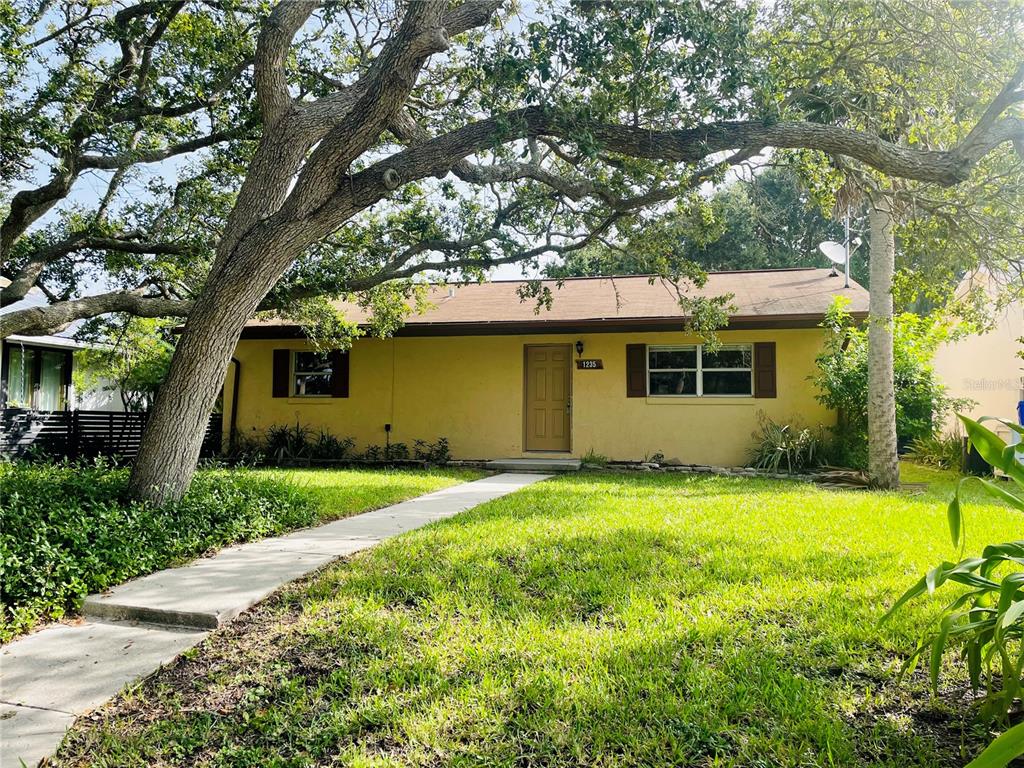 a front view of a house with a yard