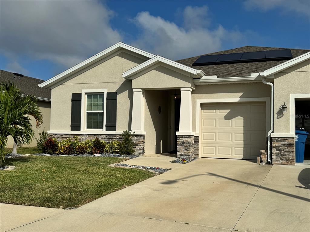 a front view of a house with a yard