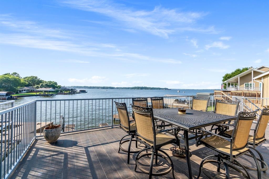 a terrace with outdoor seating and city view