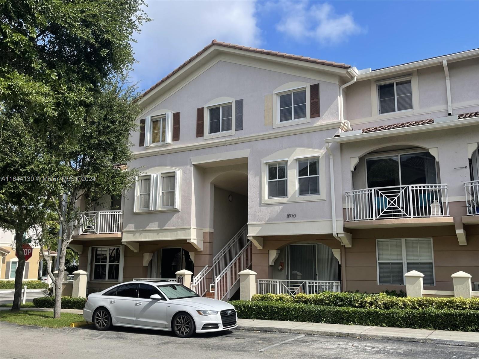 a view of a car parked in front of building