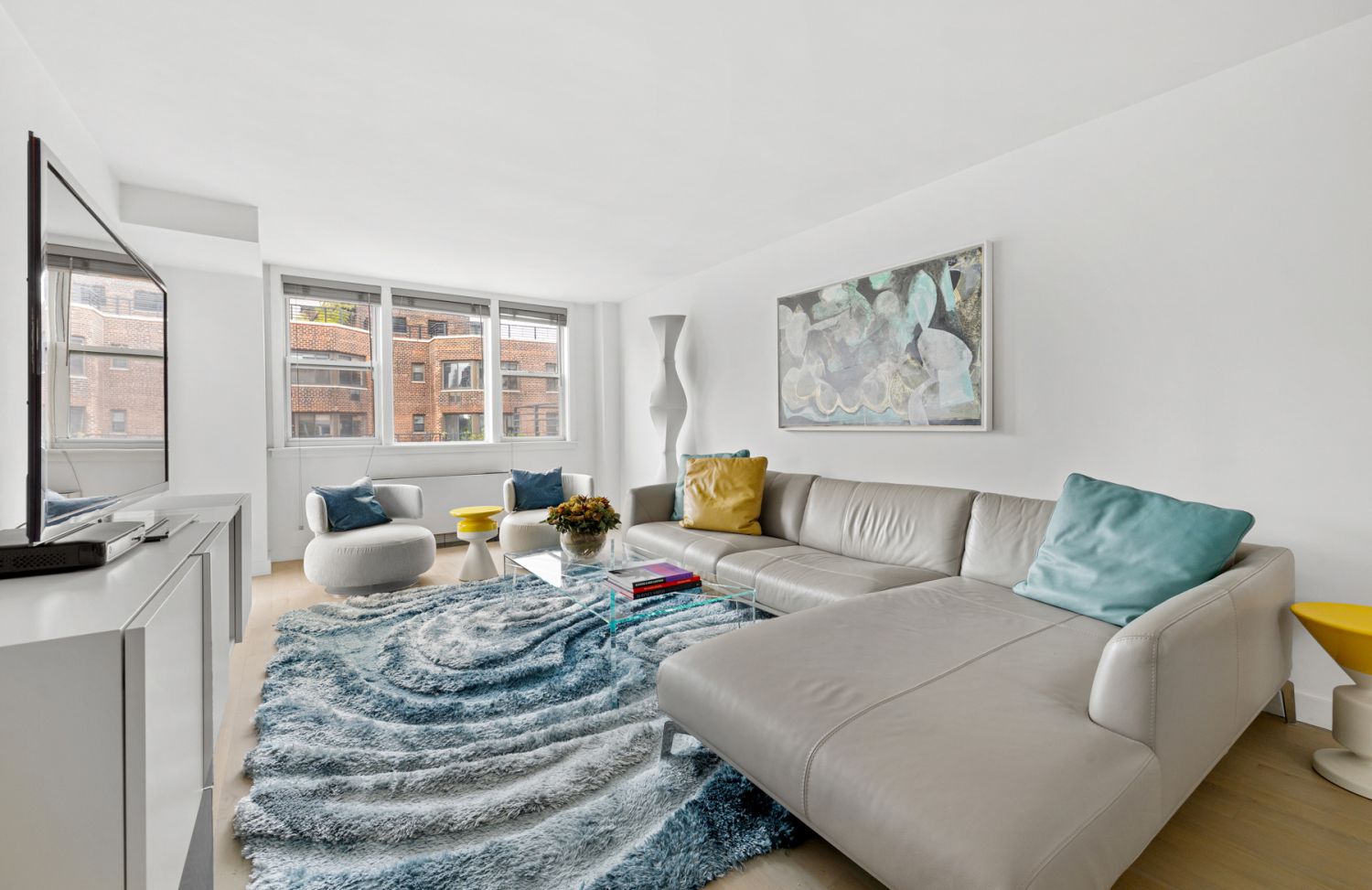 a living room with furniture and a flat screen tv