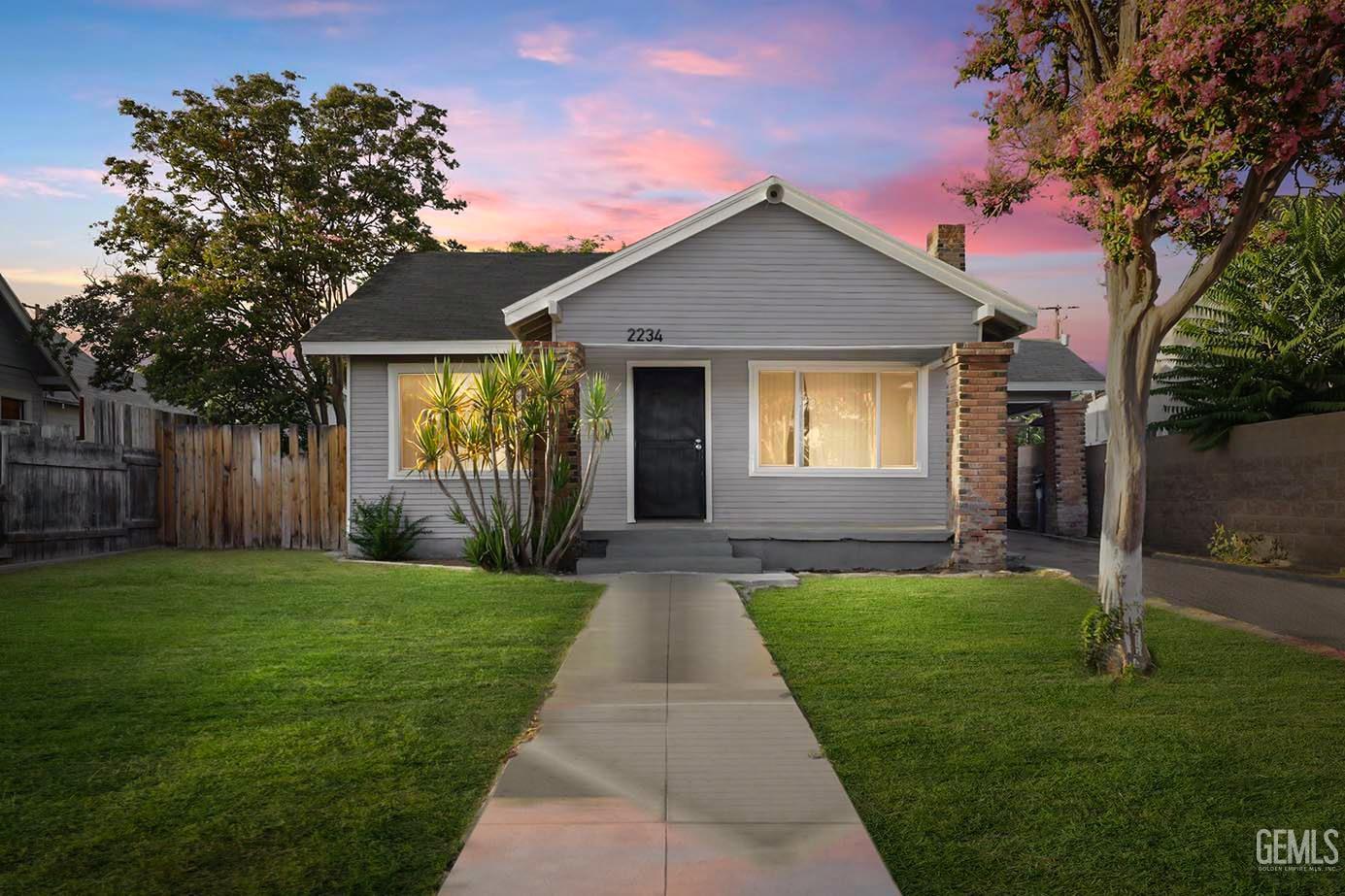 a front view of a house with yard