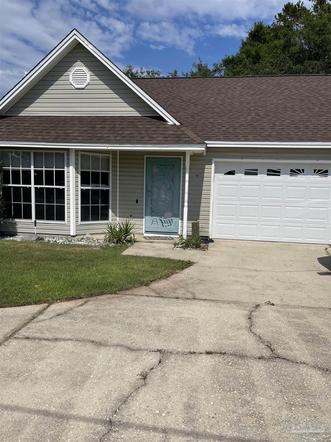 front view of a house with a yard