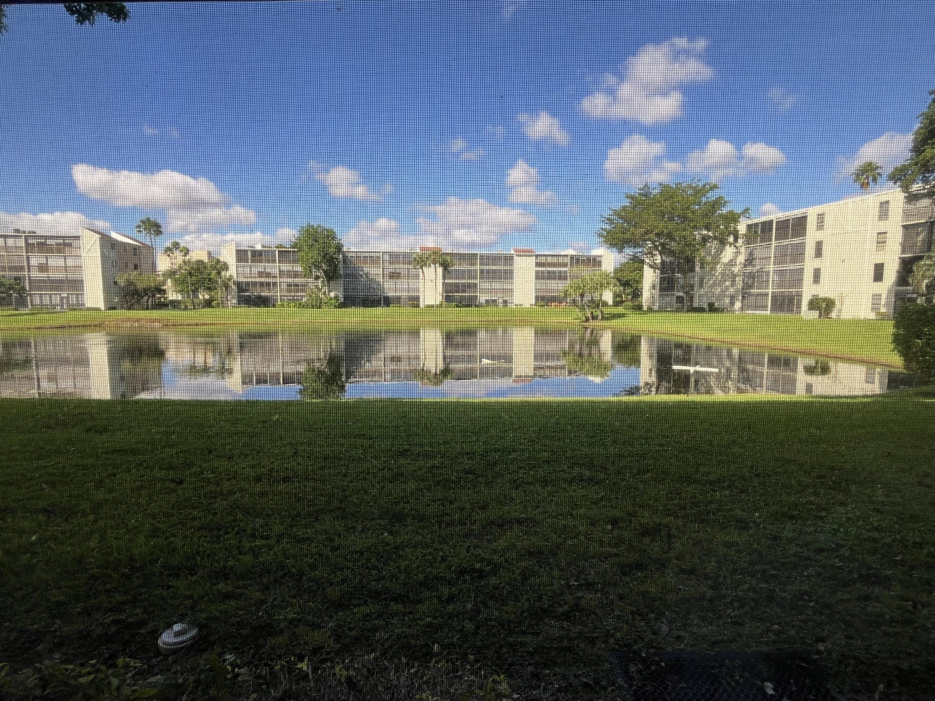 a view of building with garden in the background