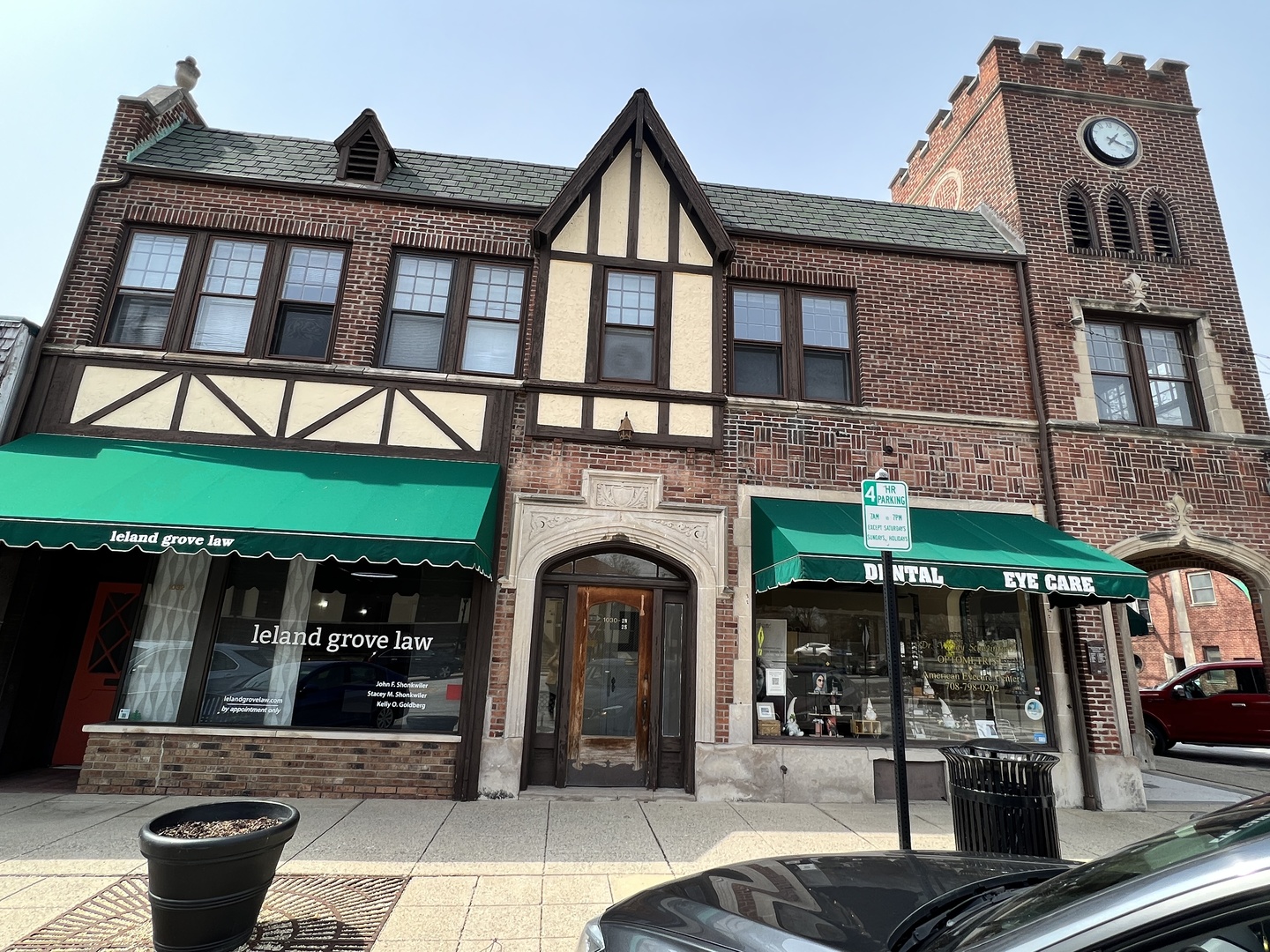 a front view of a building with retail shops