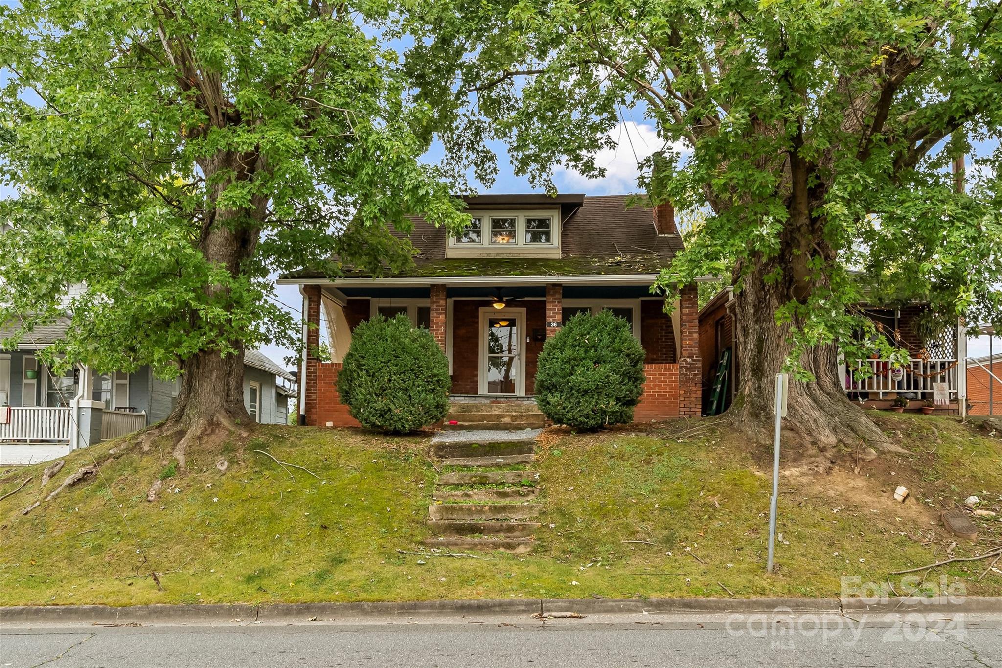 front view of a house with a yard