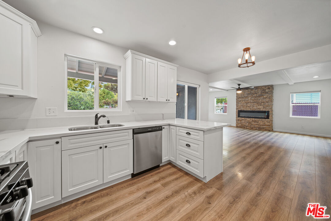 a kitchen with sink cabinets and window