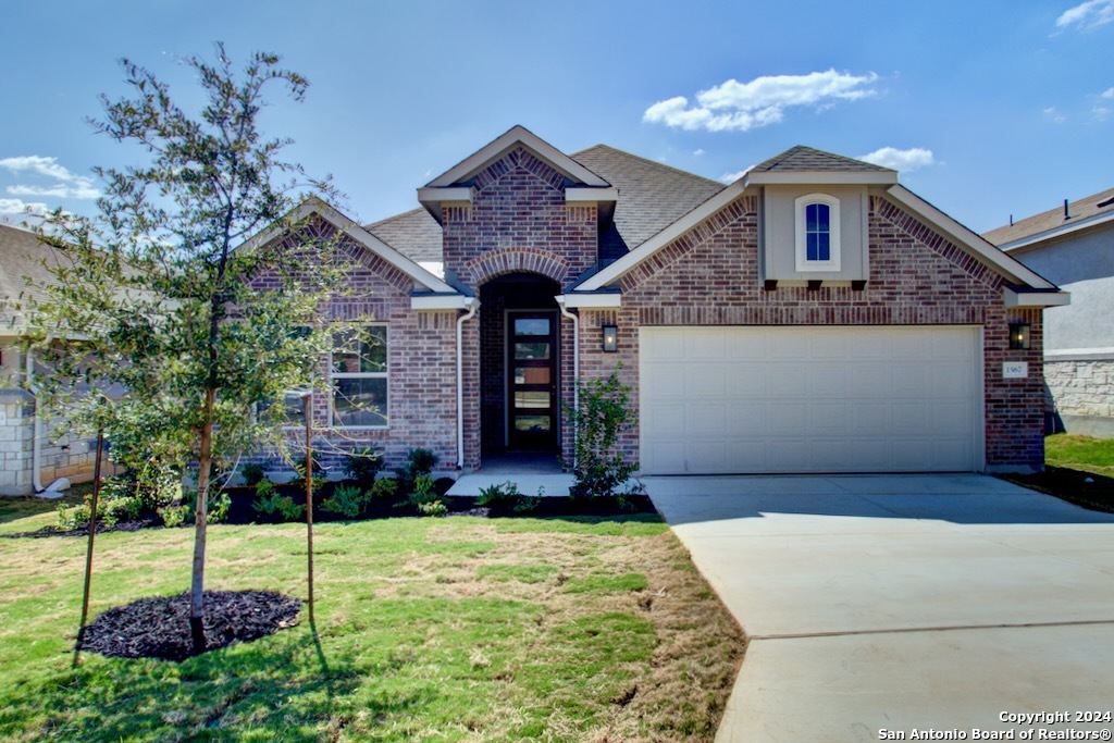 a front view of a house with a yard