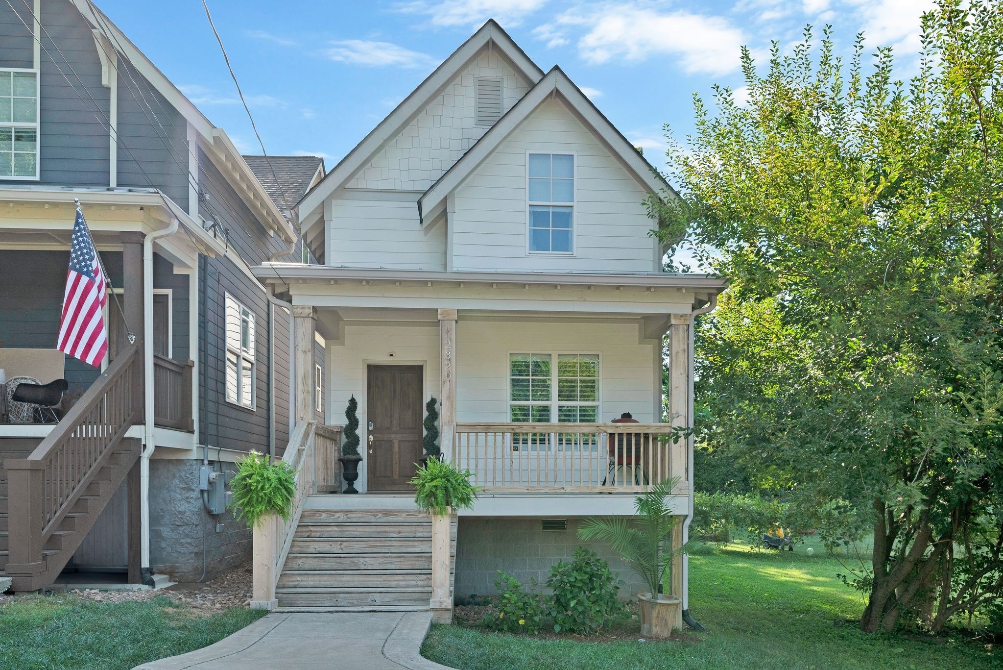 a front view of a house with garden