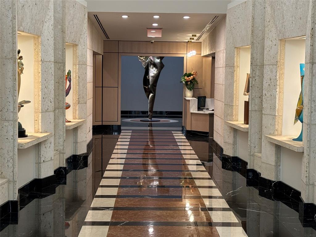 a hallway with white walls and black and white walls