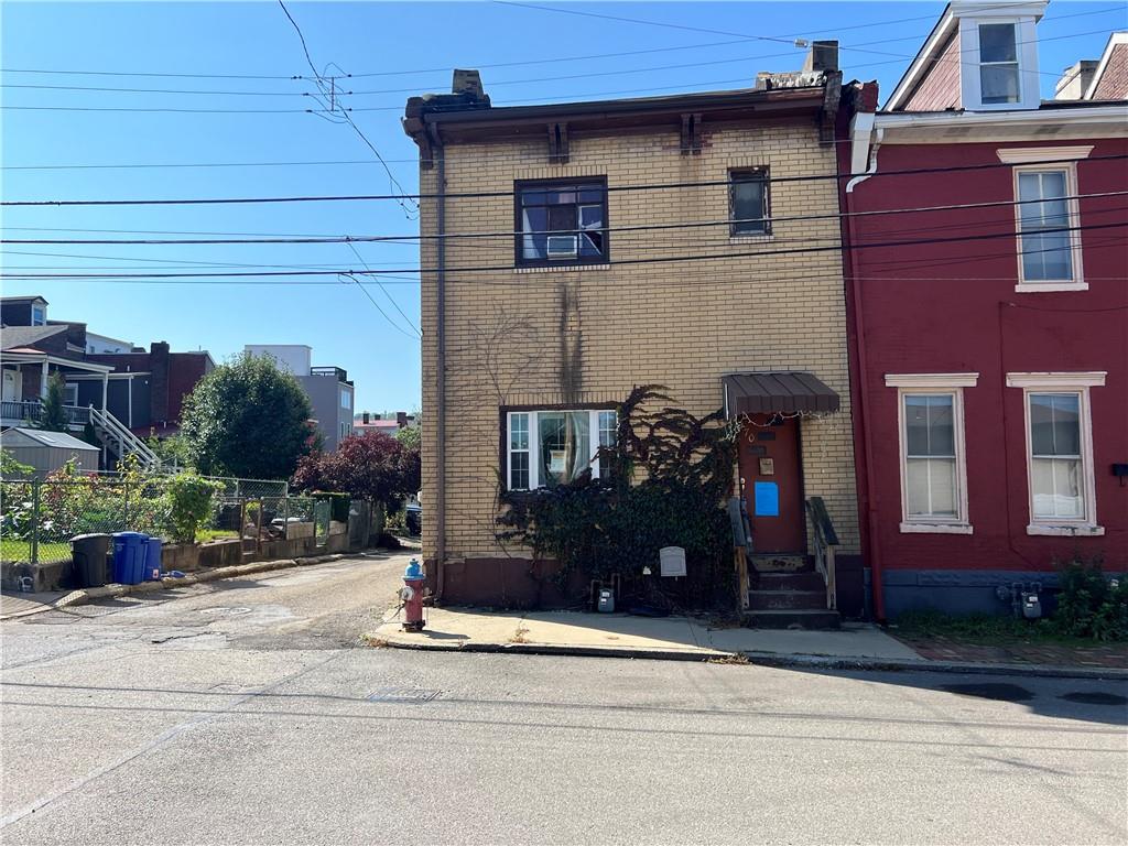 front view of a house with a street