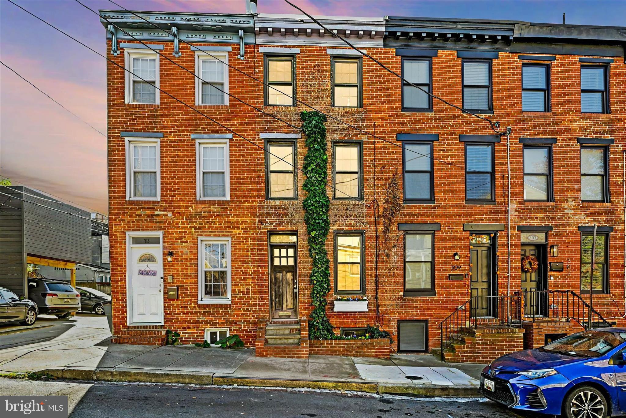 a front view of a building with lot of windows