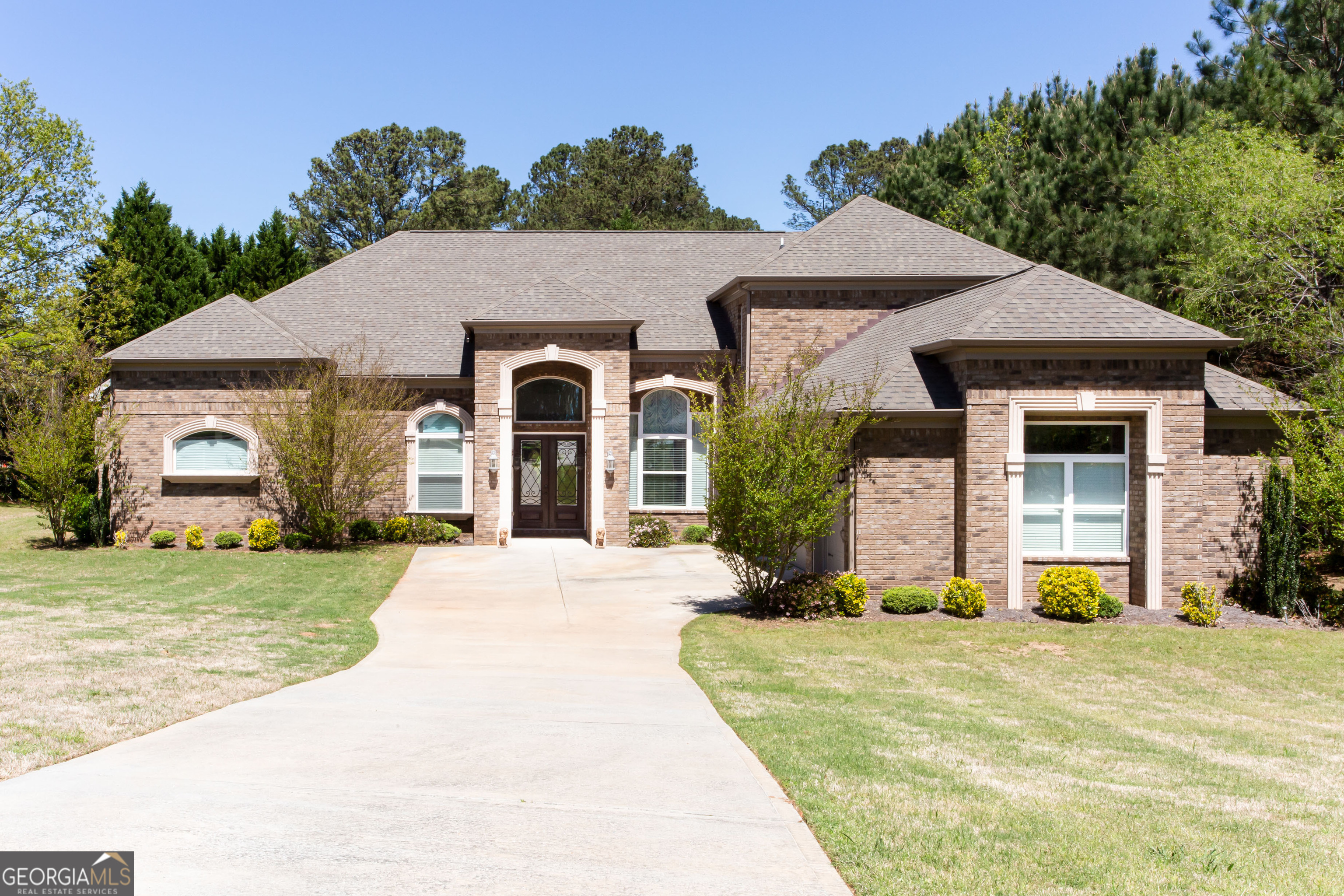 front view of a house with a yard