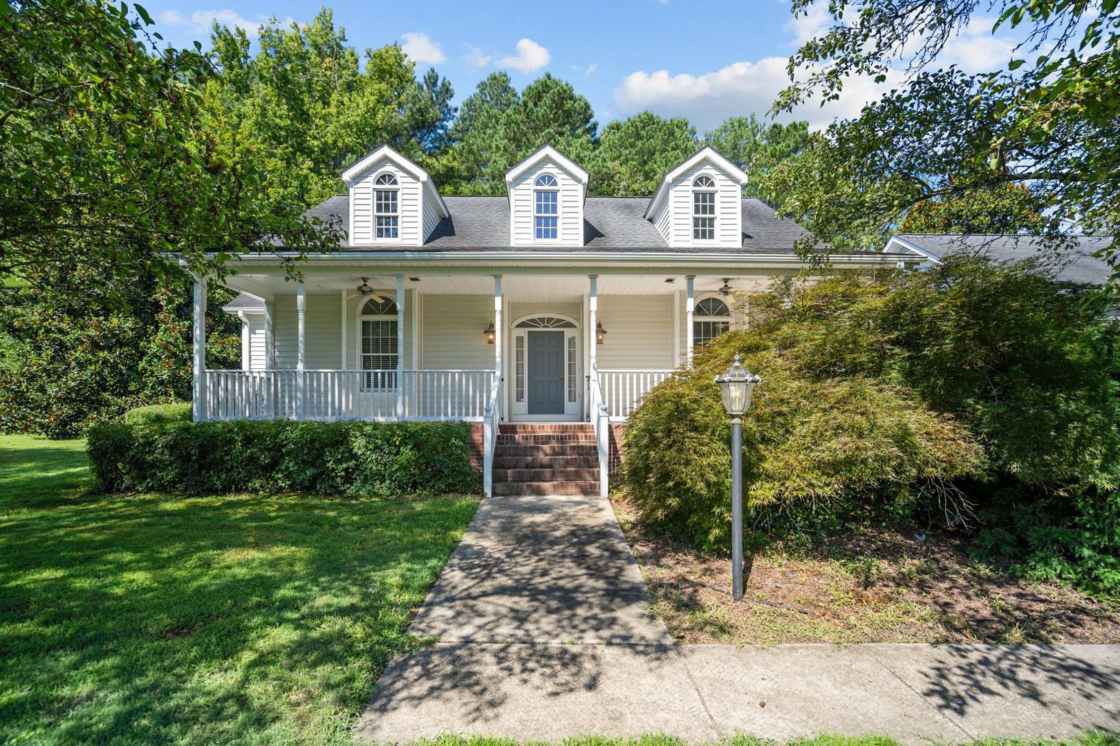 a front view of a house with garden