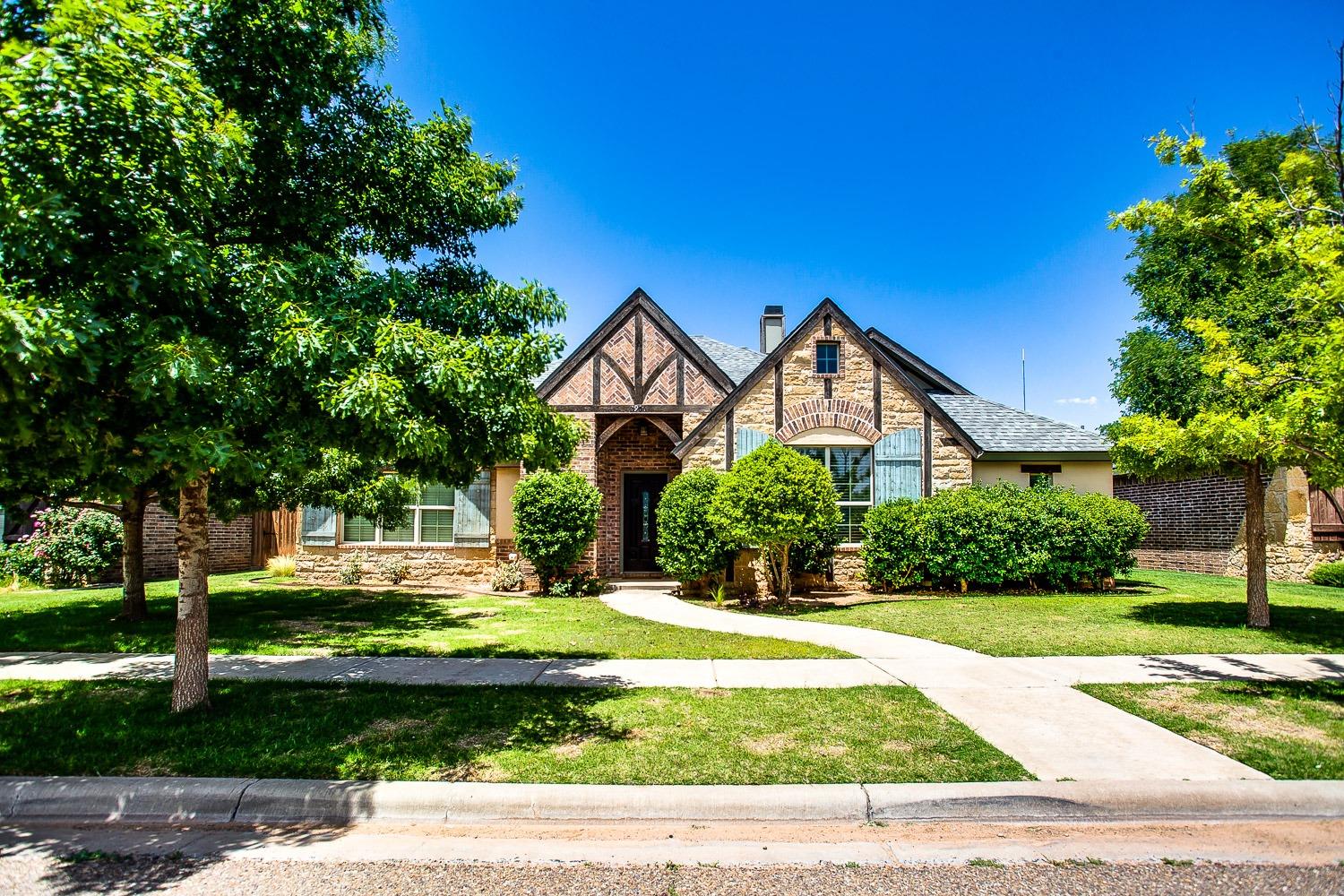 a view of house with yard and green space