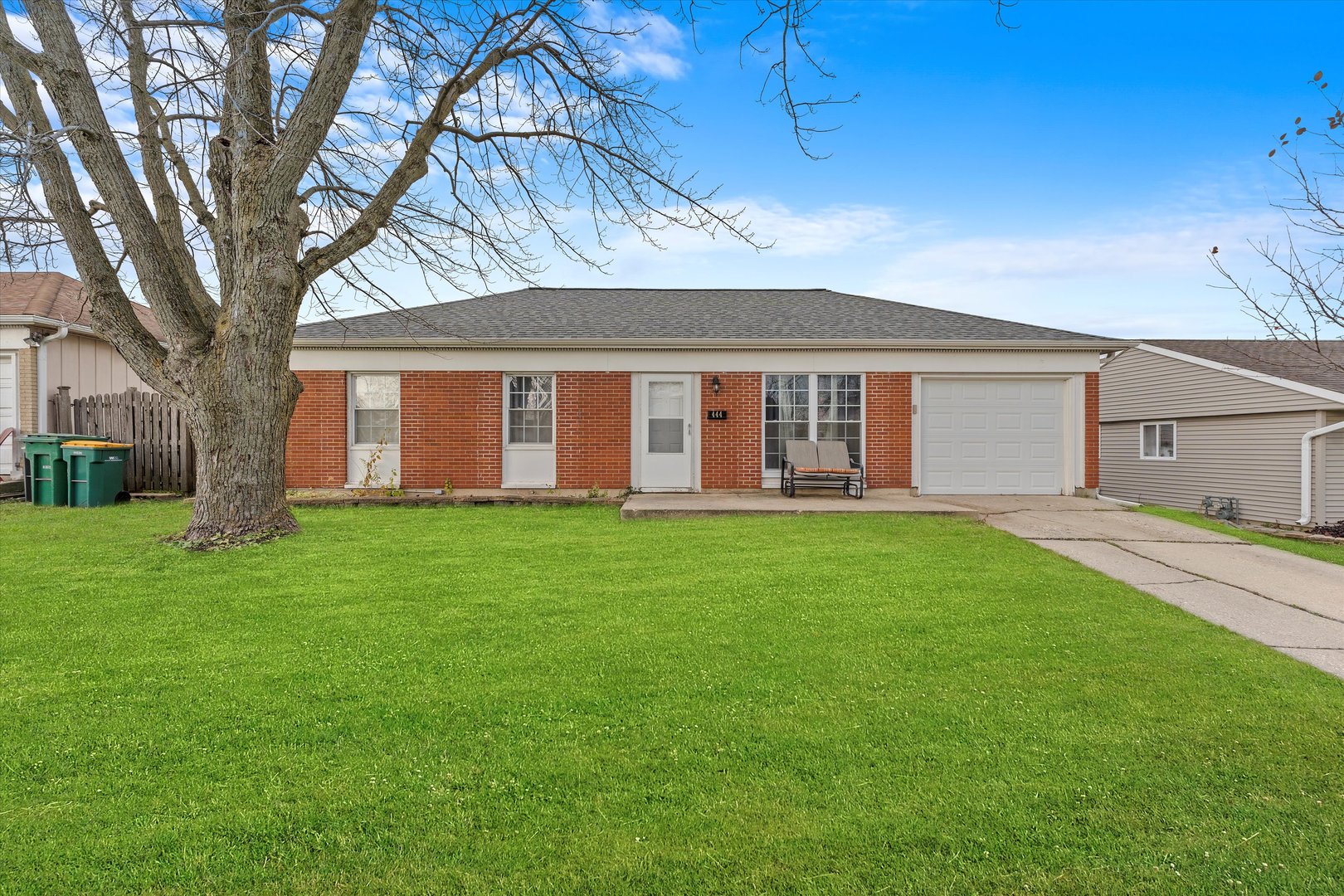 front view of a house with a yard