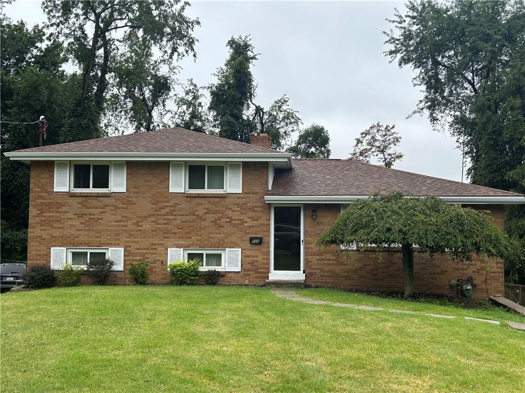 a brick house with a yard