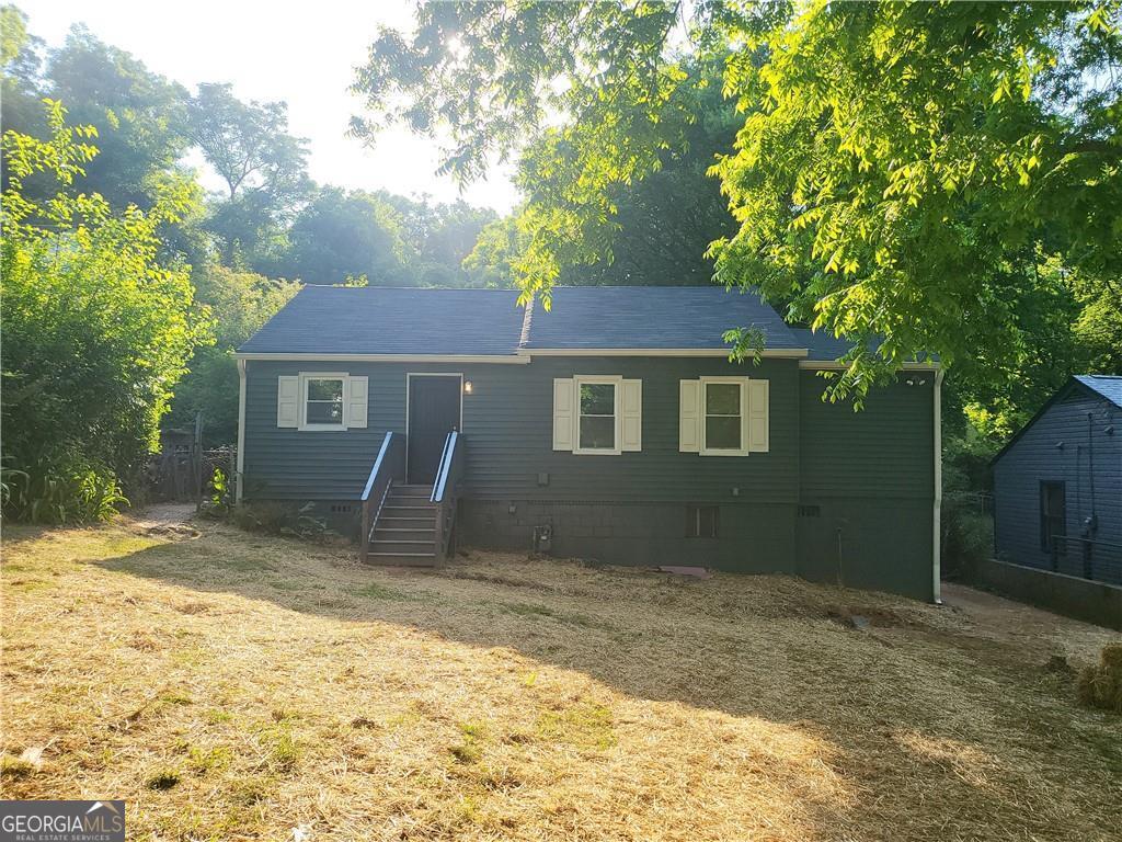 a house with trees in the background