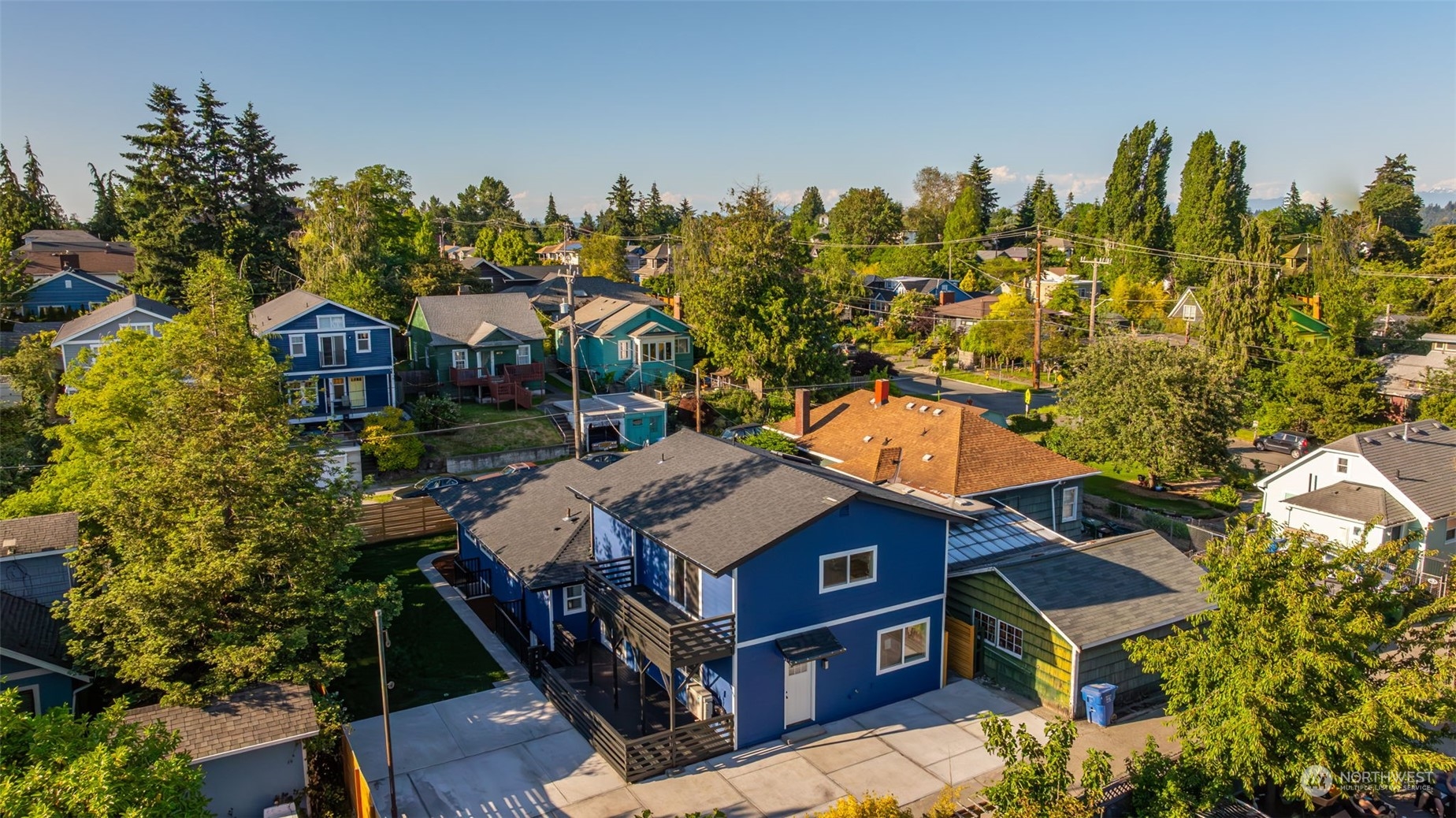 an aerial view of a residential apartment building with a yard