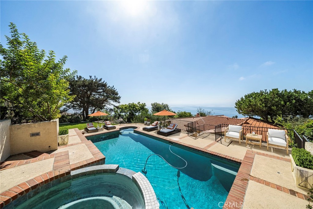 a view of a backyard with sitting area